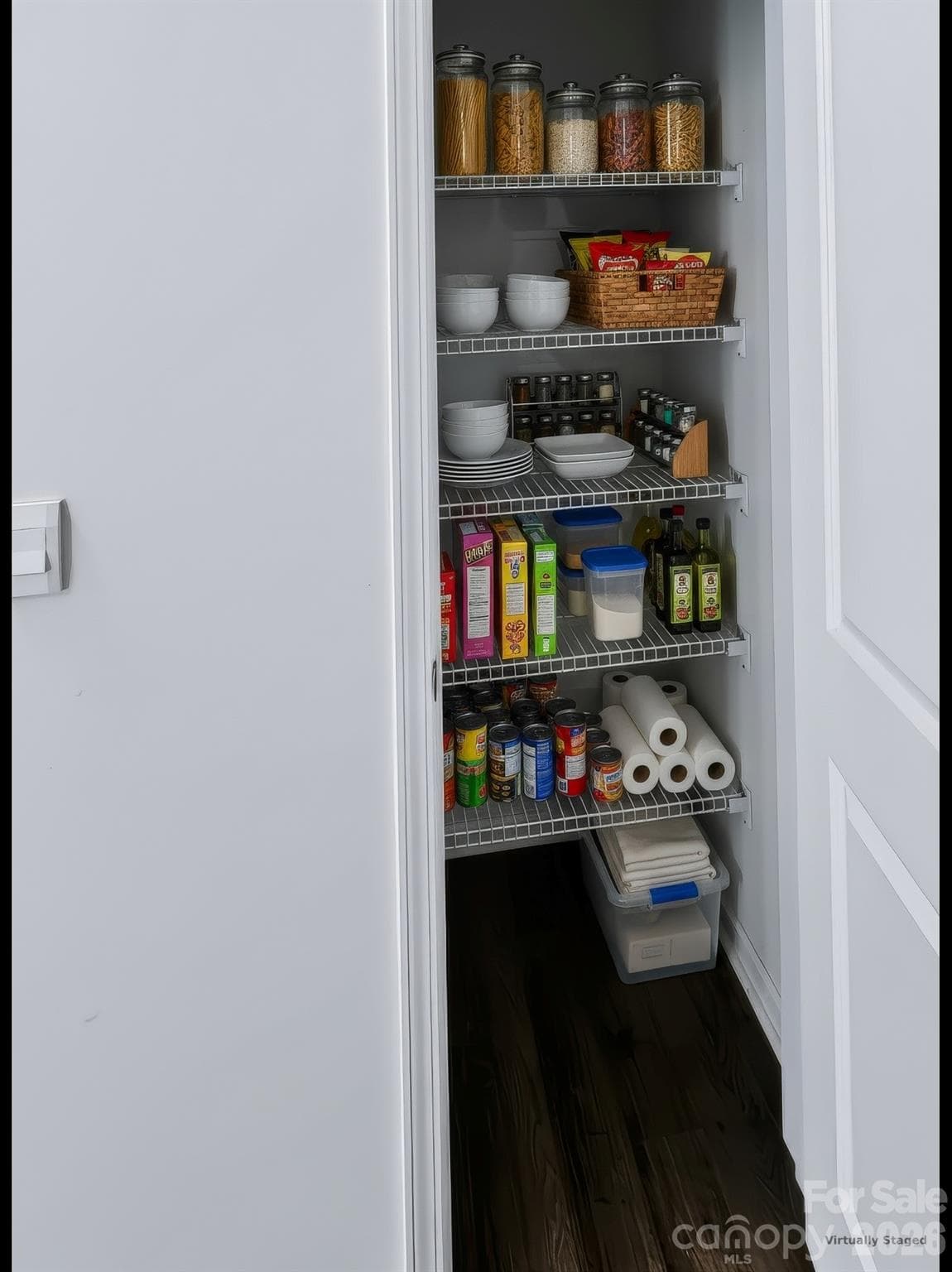 A built-in kitchen pantry offers a simple, neat spot to tuck away. - 3741 Stanley Creek Drive, Mount Holly