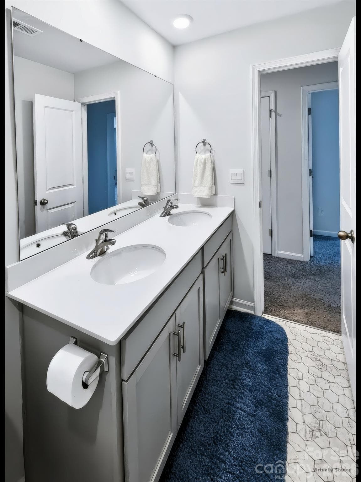 Hall bath features dual vanities. - 3741 Stanley Creek Drive, Mount Holly