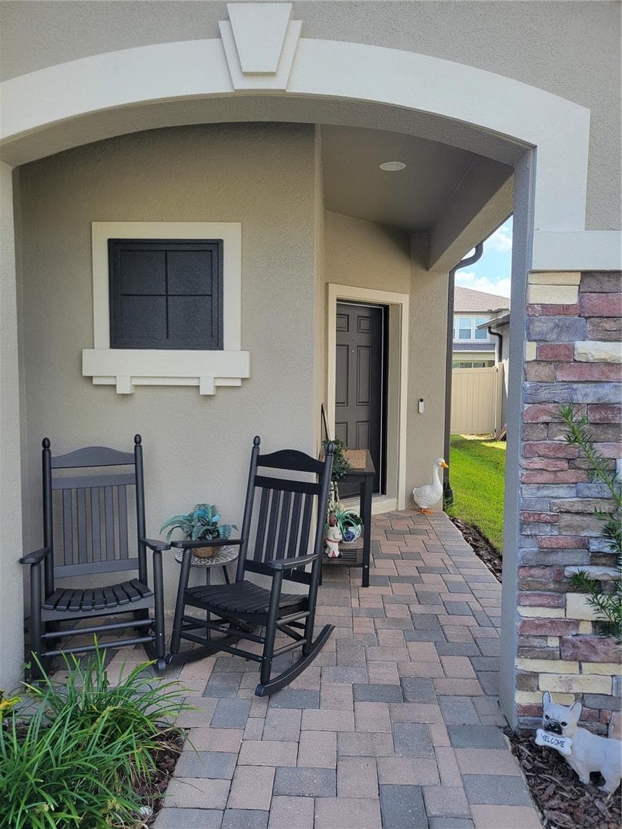 Your front porch is calling. - 37868 BEACON BRICK DR, ZEPHYRHILLS