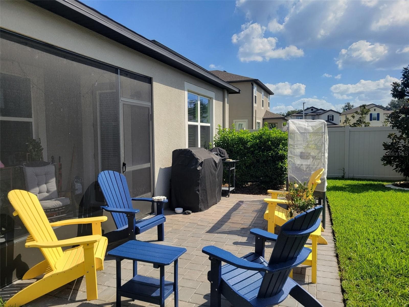 Check out the new paver patio the seller put in and the new sod in the fenced rear yard - 37868 BEACON BRICK DR, ZEPHYRHILLS