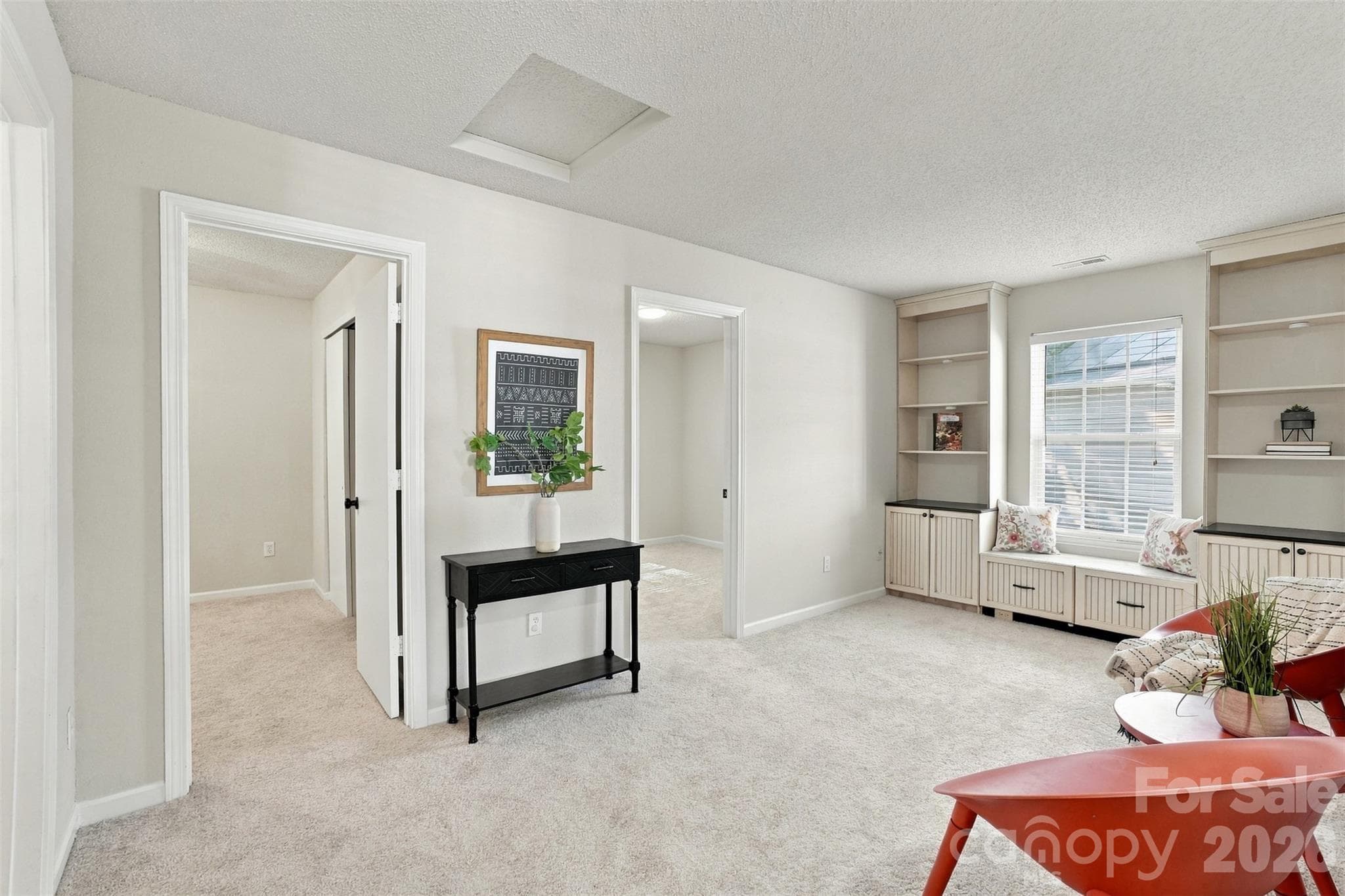 Loft area w/built-in bookshelves, cabinets and window seat. - 1901 Beckwith Lane, Waxhaw