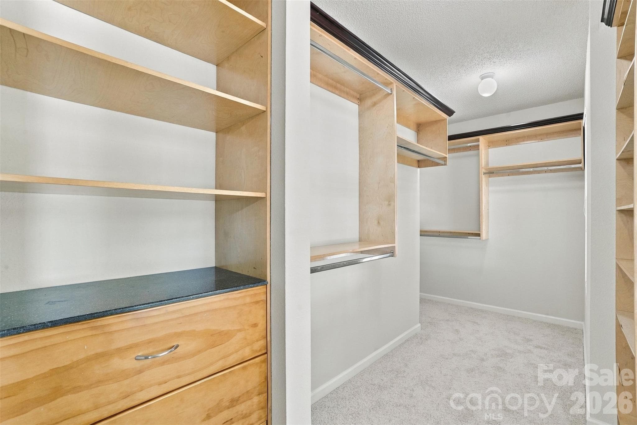 Large walk-in closet w/built-in shelves and drawers. - 1901 Beckwith Lane, Waxhaw