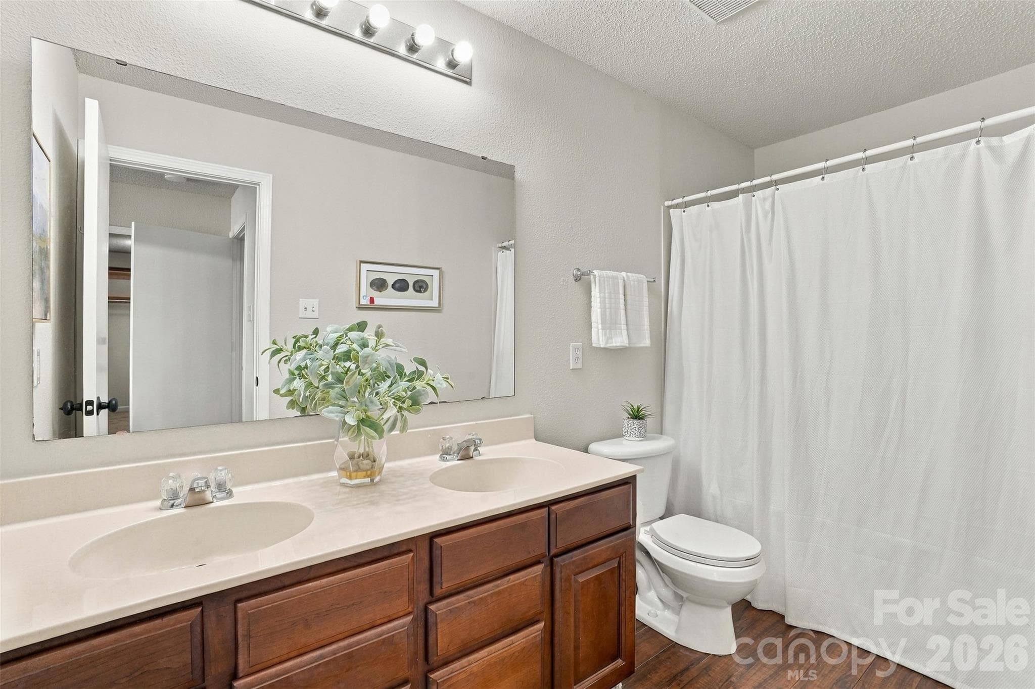 Primary bathroom with dual vanity. - 1901 Beckwith Lane, Waxhaw