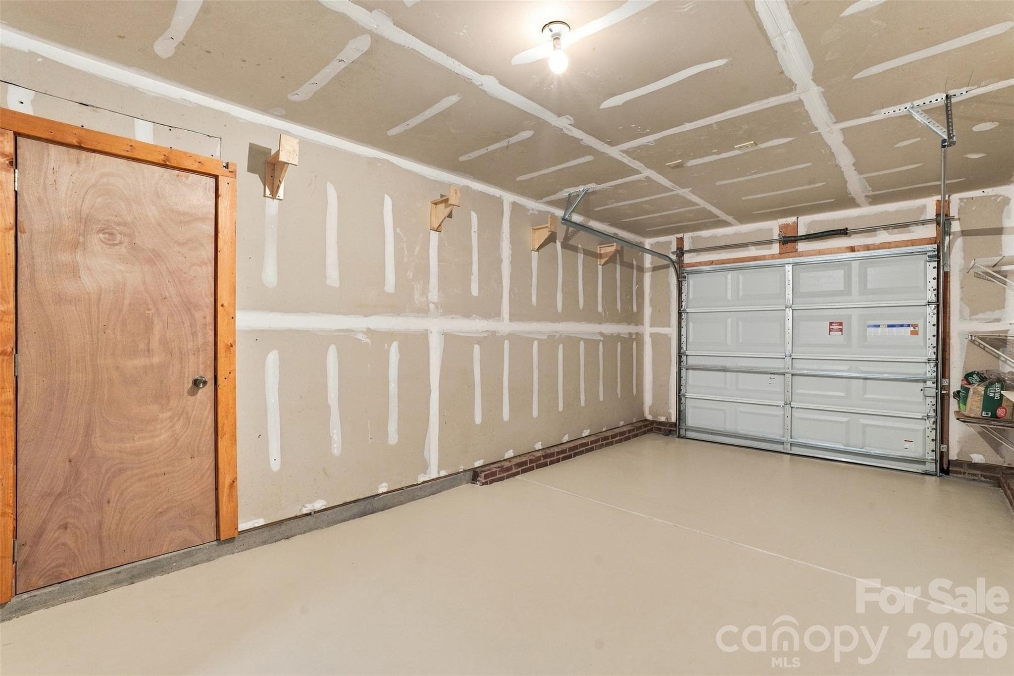 Single car garage w/storage room. - 1901 Beckwith Lane, Waxhaw