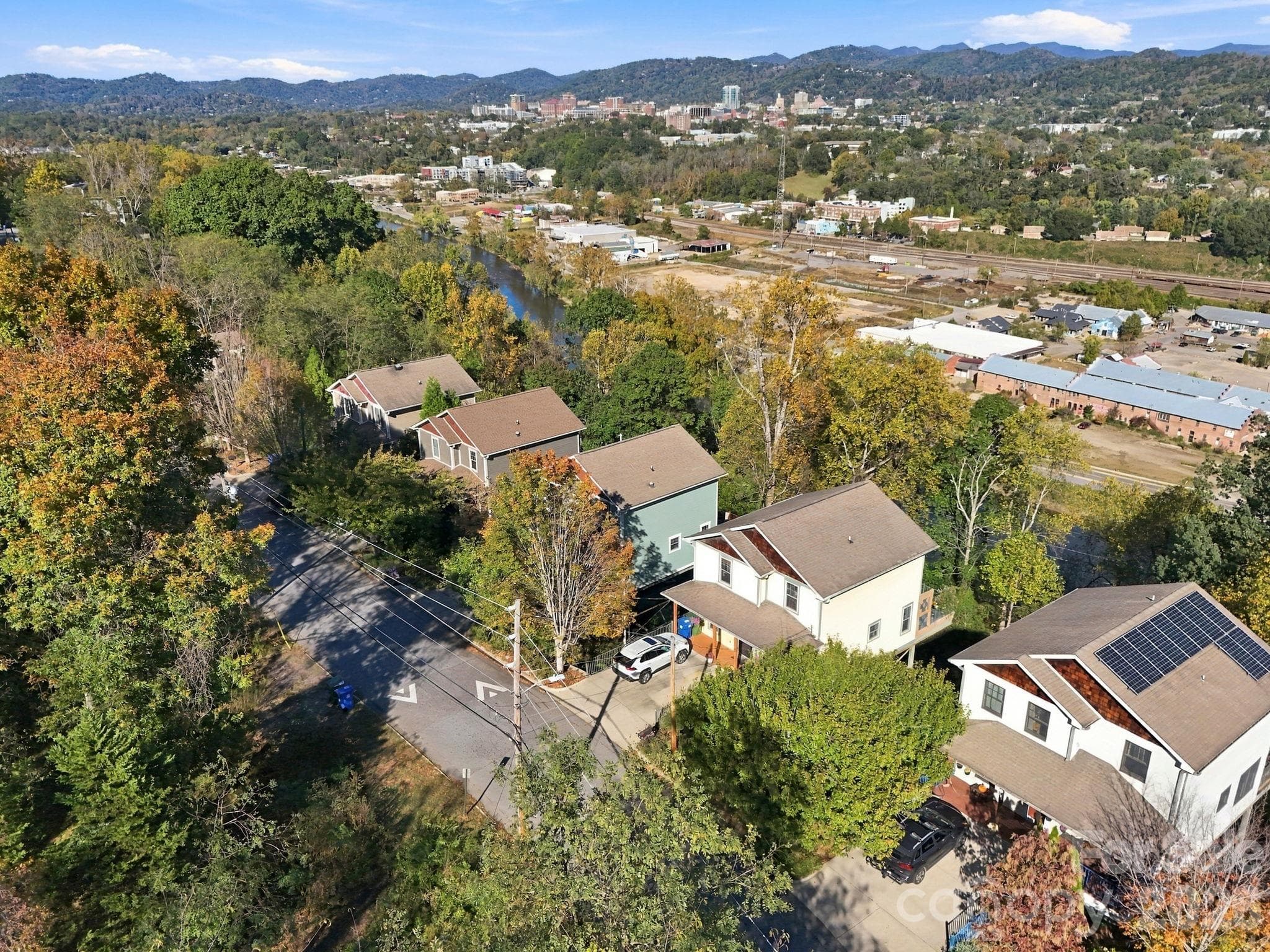 3rd from the Right; Speed hump next to the house to ensure slow drivers (front of the house) - 272 Riverview Drive, Asheville