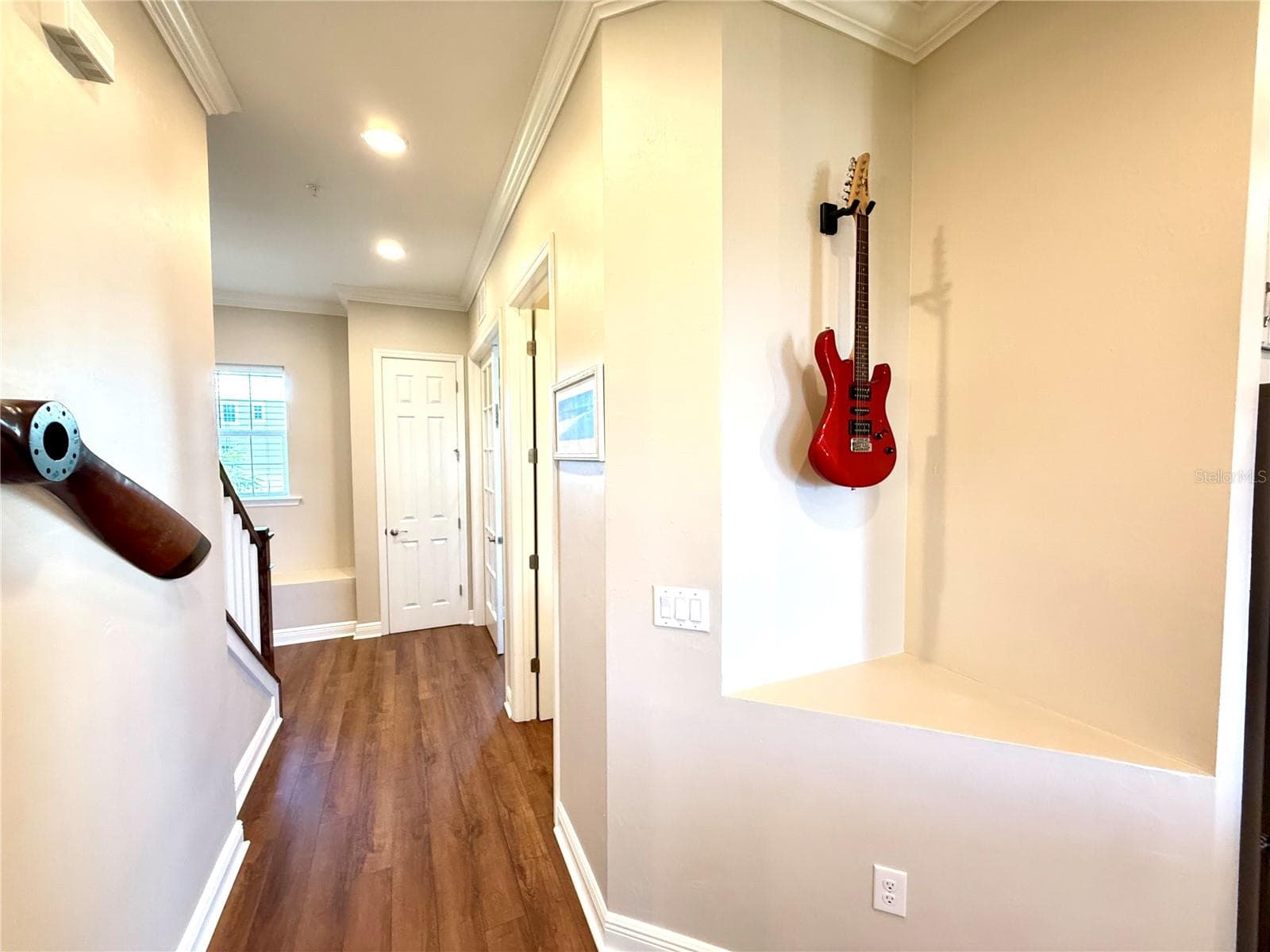 Hallway to the first primary suite and stairs to the 3rd floor - 10320 LANDS END CIR #47, PLACIDA