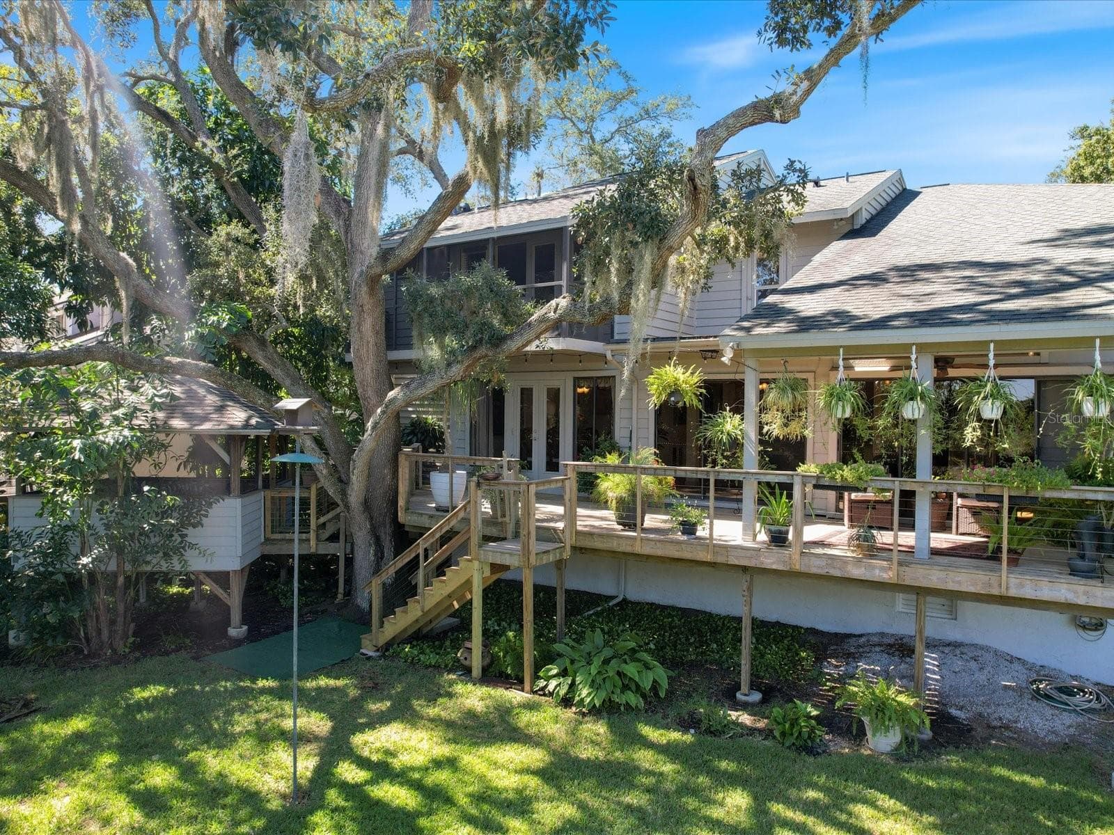 Full length decks along the back of the house - 3328 BRIARWOOD CIR, SAFETY HARBOR