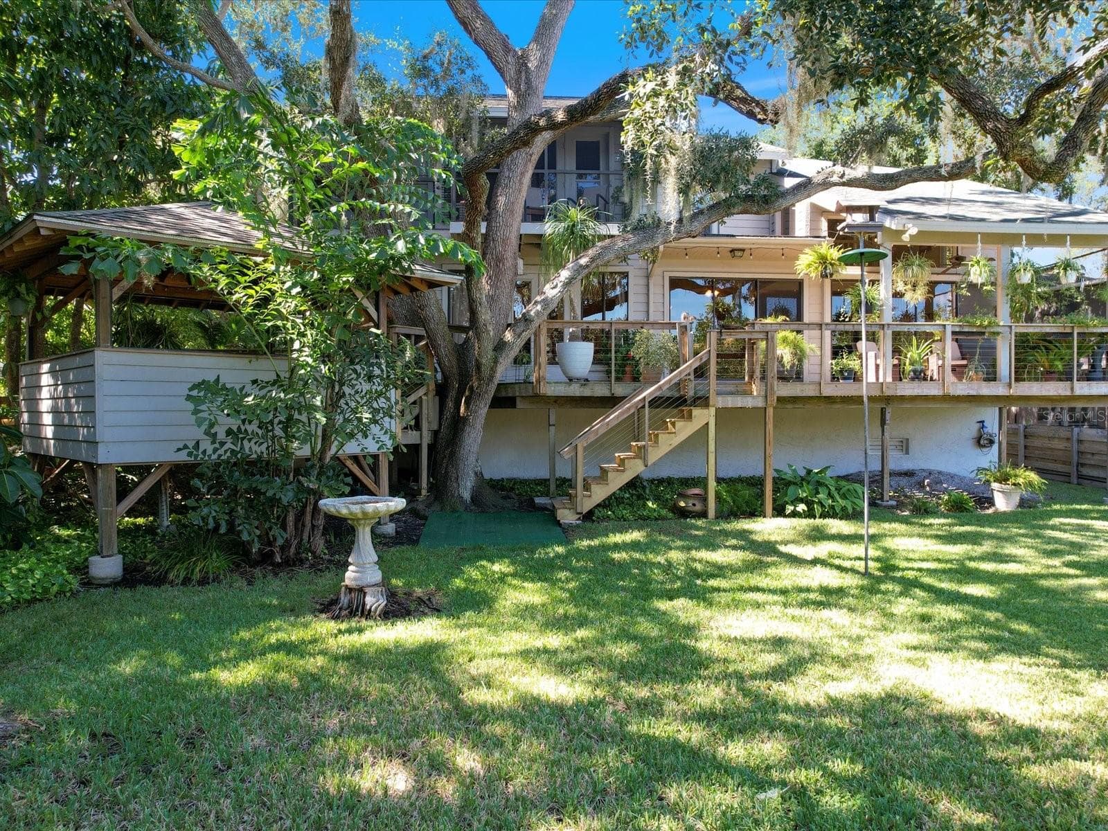 Access to the porch and Gazebo to the left nestled among the trees - 3328 BRIARWOOD CIR, SAFETY HARBOR