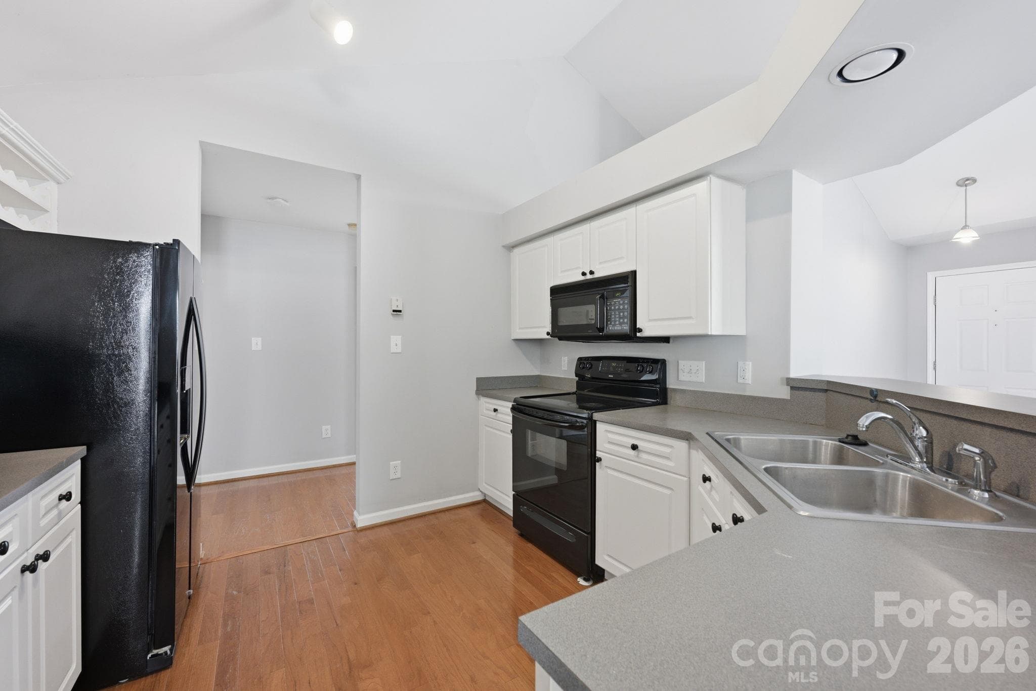 Your Kitchen is nice and bright AND the Refrigerator conveys! - 4000 Huntmeadow Drive, Charlotte