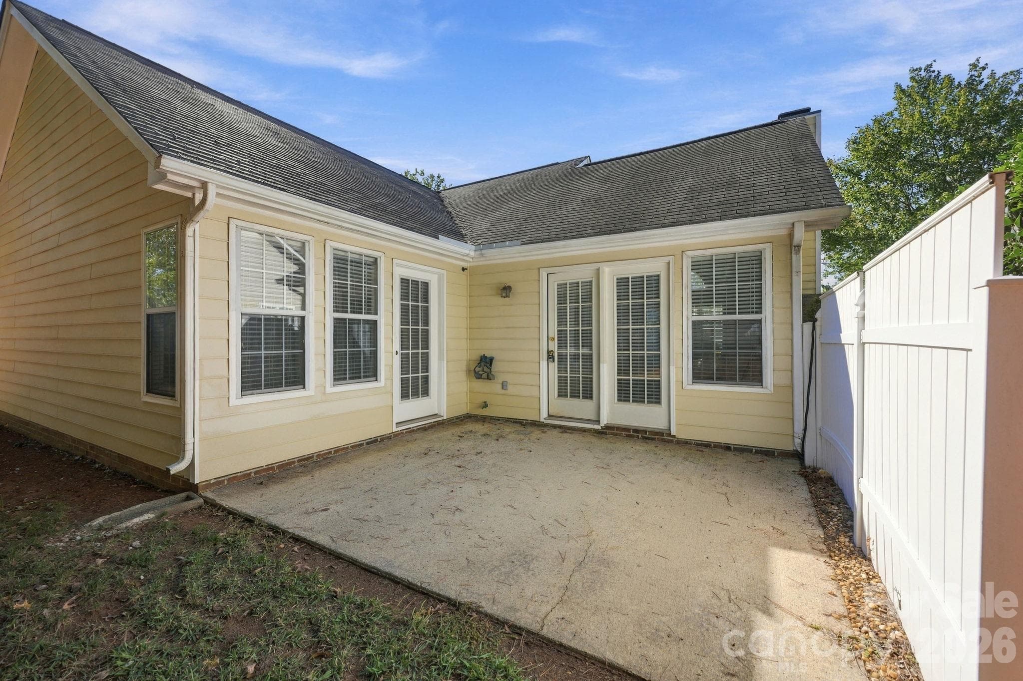 This is the Patio and there is a privacy fencing wall! - 4000 Huntmeadow Drive, Charlotte