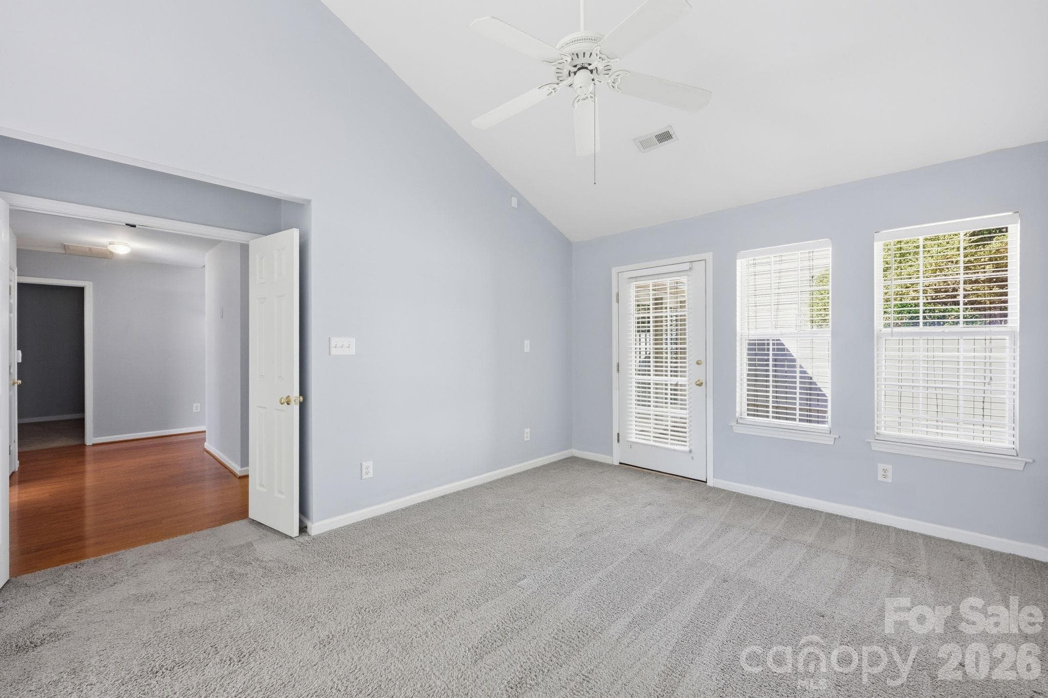 The Primary Bedroom is spacious and complimented by a high ceiling! There's plenty of privacy to as this home has a split bedroom feature! - 4000 Huntmeadow Drive, Charlotte