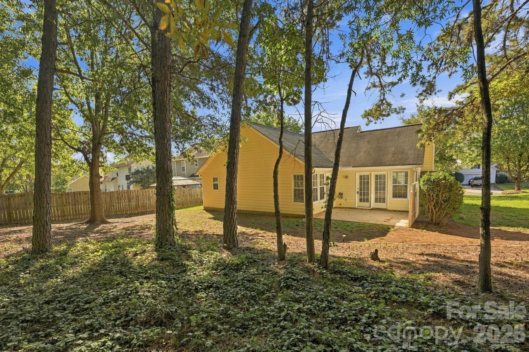 A view of the home from the backyard. - 4000 Huntmeadow Drive, Charlotte