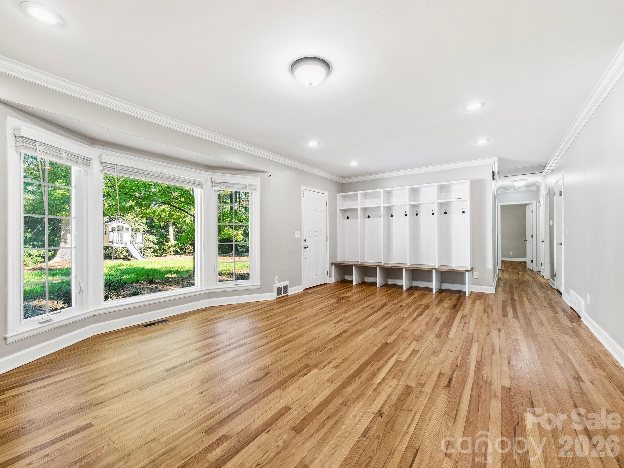 Living Room features a bay window, built in cubbies by the front door and a fireplace. - 175 Mimosa Road, Columbus