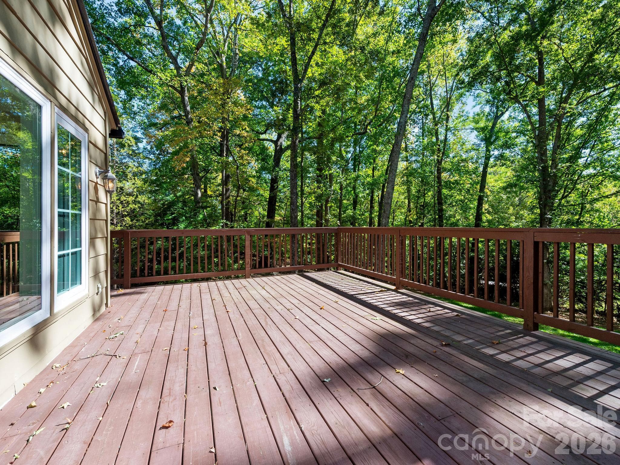 The large deck surrounded by mature trees offers privacy. - 175 Mimosa Road, Columbus