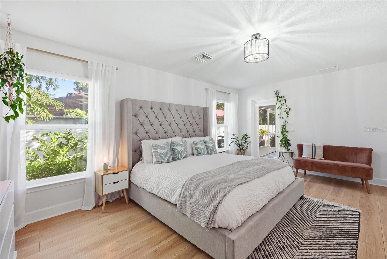 Large primary bedroom with en-suite and private access to lanai space. - 300 FORDHAM RD, VENICE