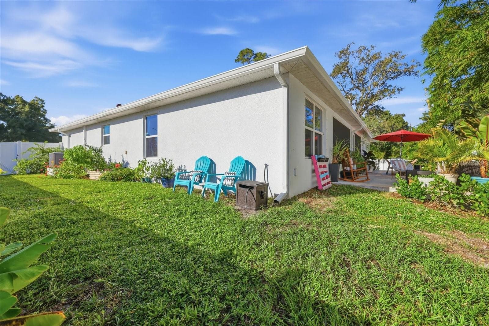 Side yard with an assortment of tropical plants, fruit trees and edible plants. - 300 FORDHAM RD, VENICE