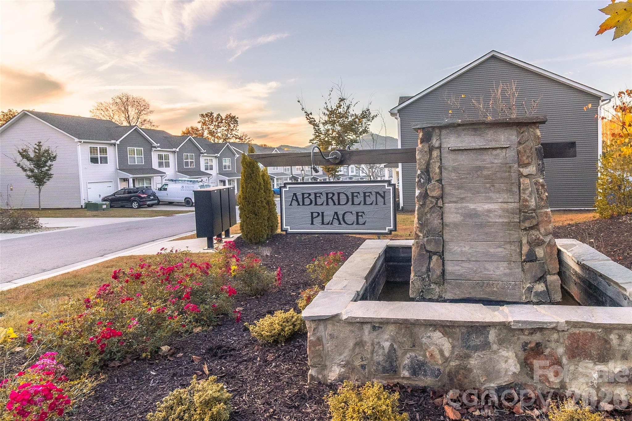 Mailboxes and manicured landscaping as you enter. - 34 Cain Hollow Way, Asheville