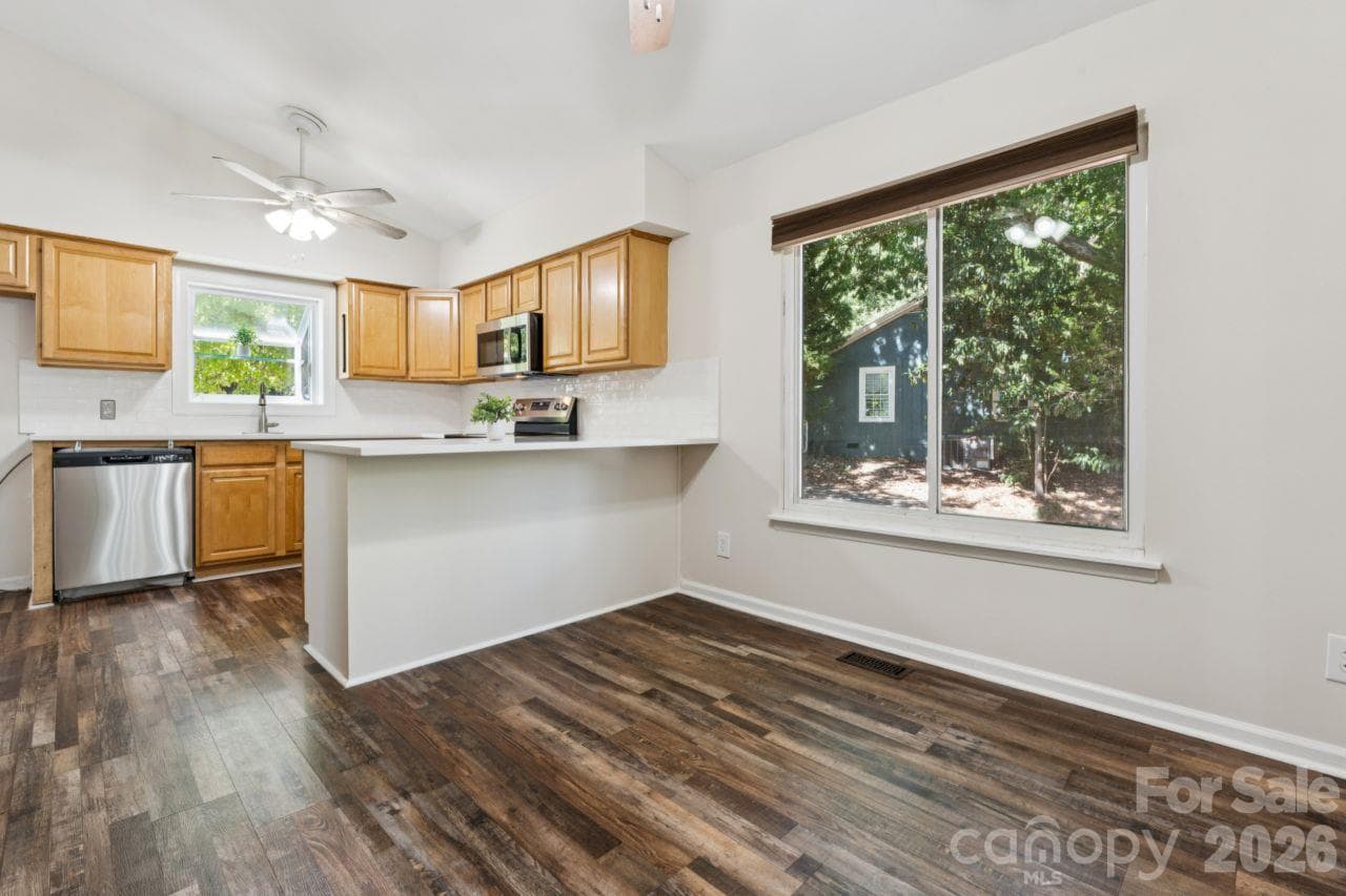 Dining area into kitchen - 3106 Point Clear Drive, Tega Cay