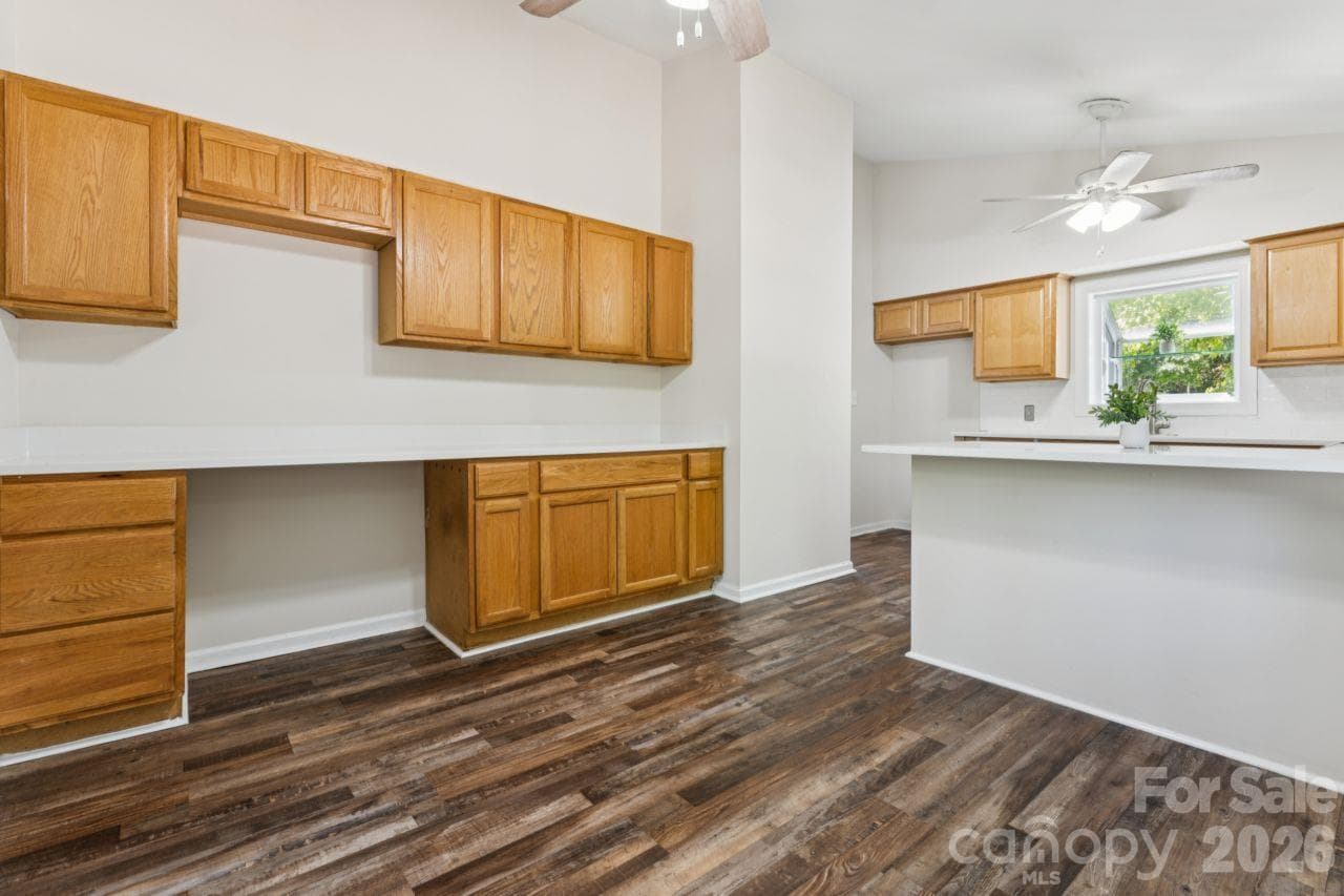 Dining area into kitchen with separate workspace - 3106 Point Clear Drive, Tega Cay