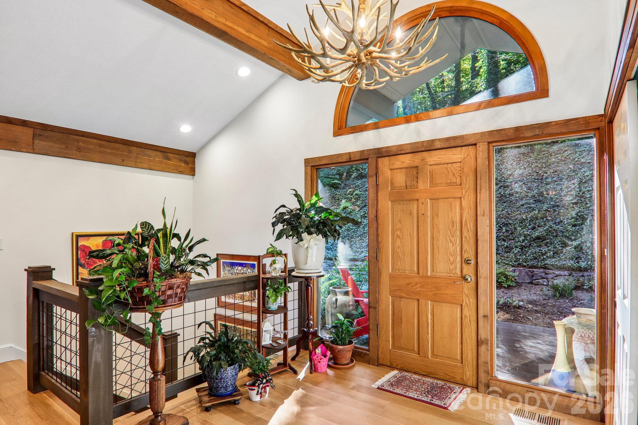 Welcoming foyer with open living room with wood burning fireplace - 212 Pheasant Run, Hendersonville
