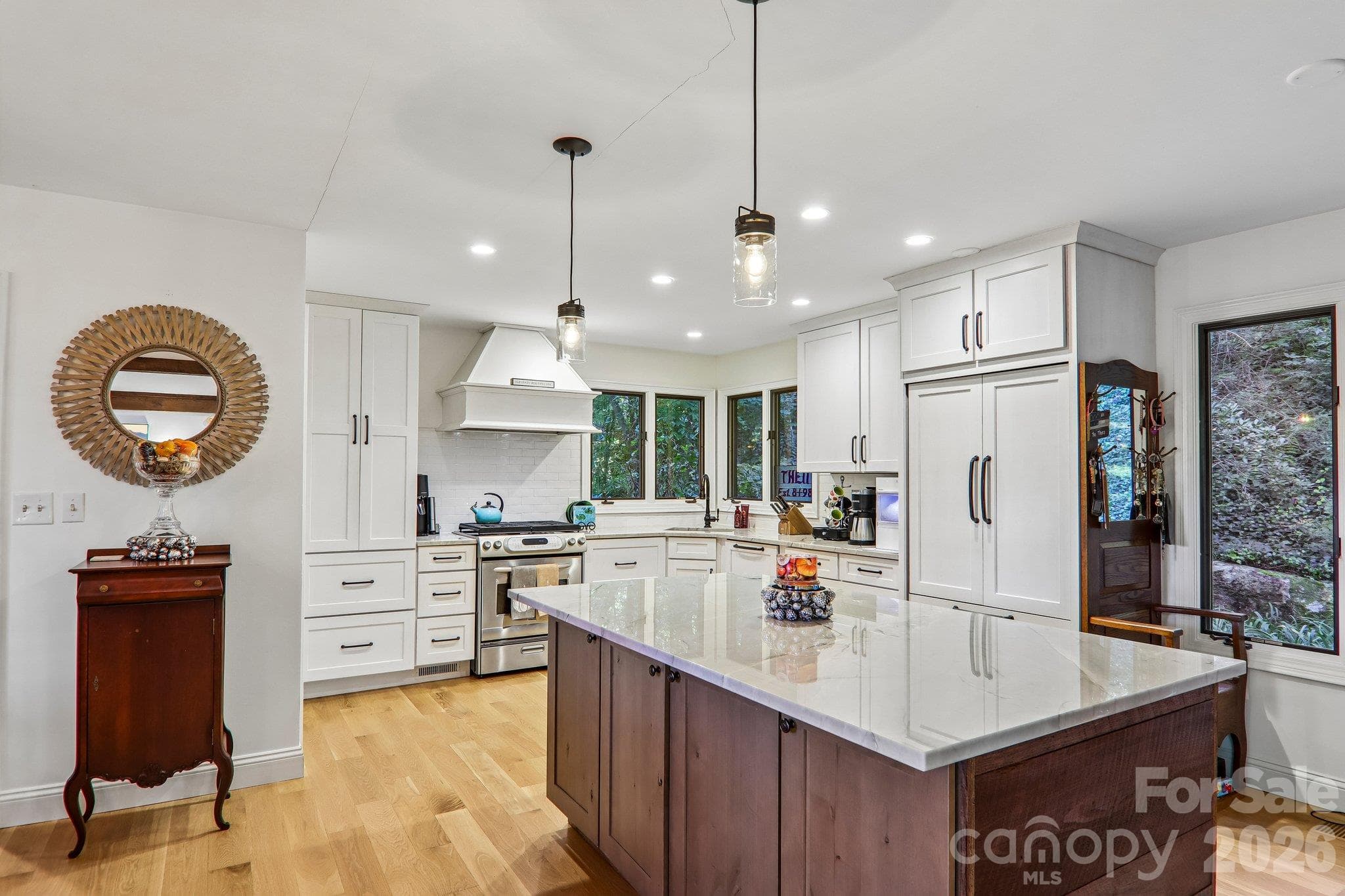 A cooks delight this beautiful kitchen with Quartz counter tops, gas range and  Fisher & Paykel refrigerator - 212 Pheasant Run, Hendersonville