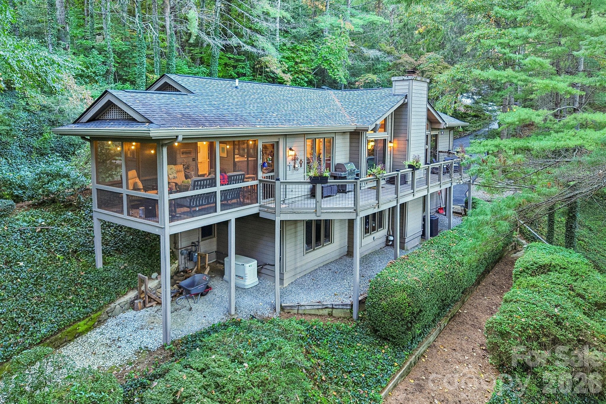 View of the back of the home - 212 Pheasant Run, Hendersonville