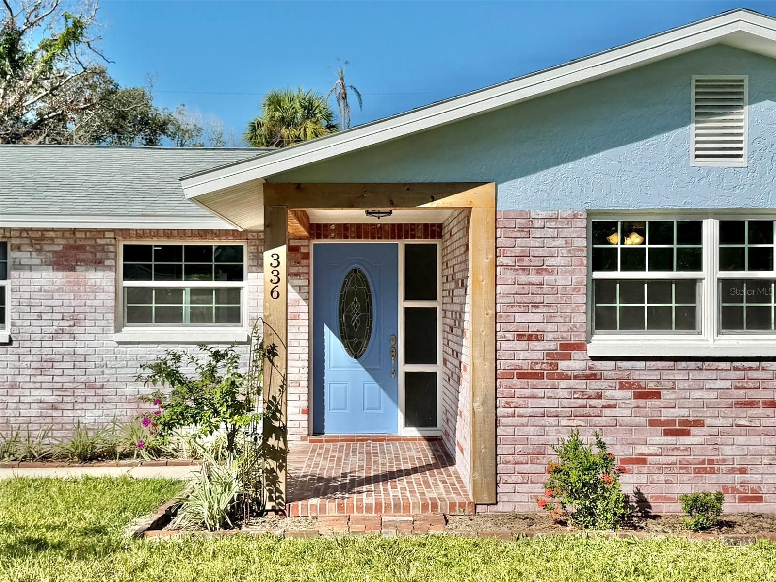 Warm Cedar Accents Surround the Covered Front Porch - 336 SHADDOCK ST, TARPON SPRINGS