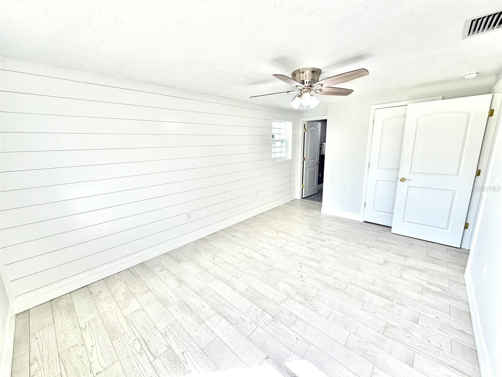 Primary Bedroom with Shiplap Wall - 336 SHADDOCK ST, TARPON SPRINGS