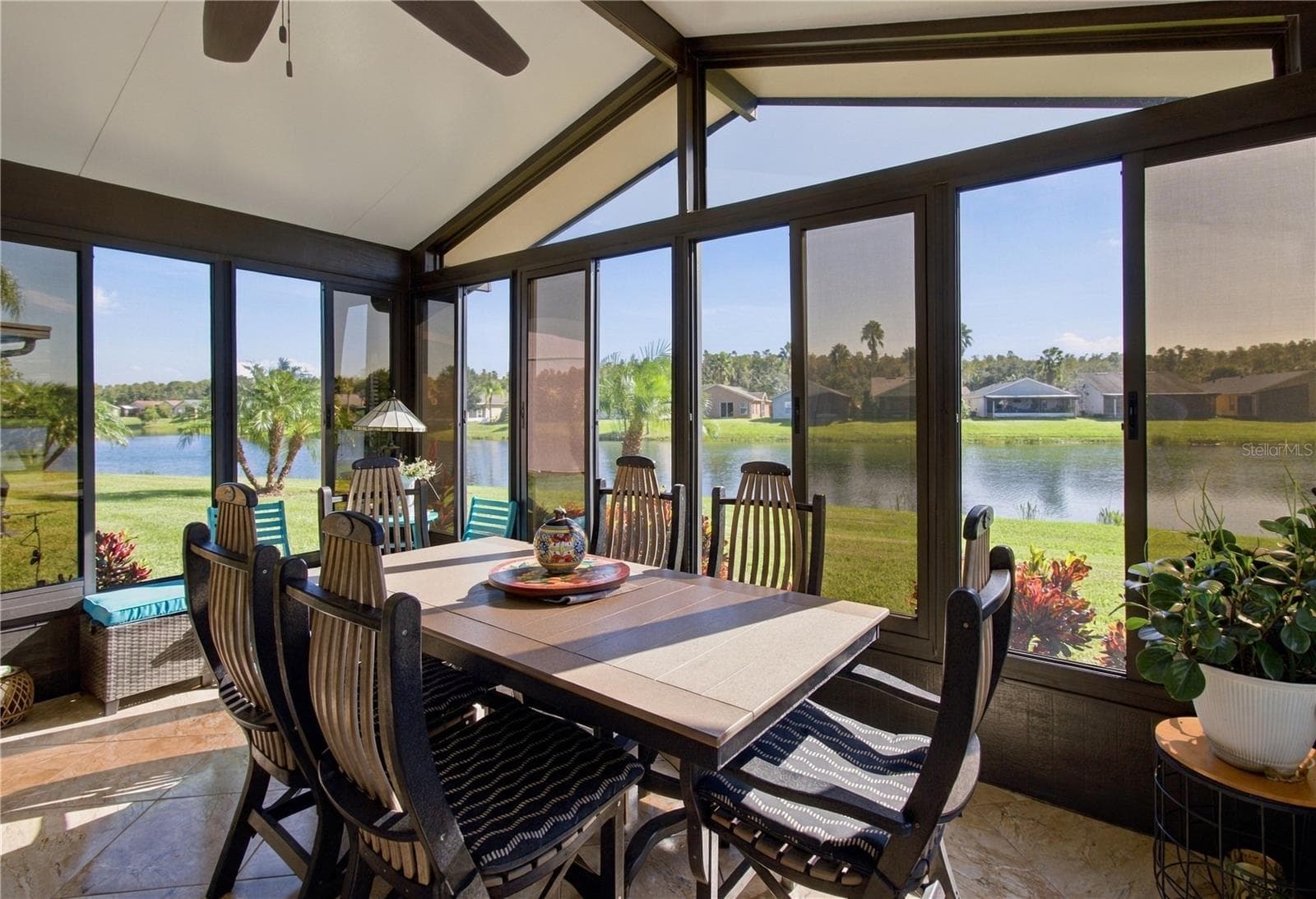 ENJOY SUNRISE VIEWS FROM ENCLOSED TILED SUNROOM - 137 RIALTO RD, POINCIANA