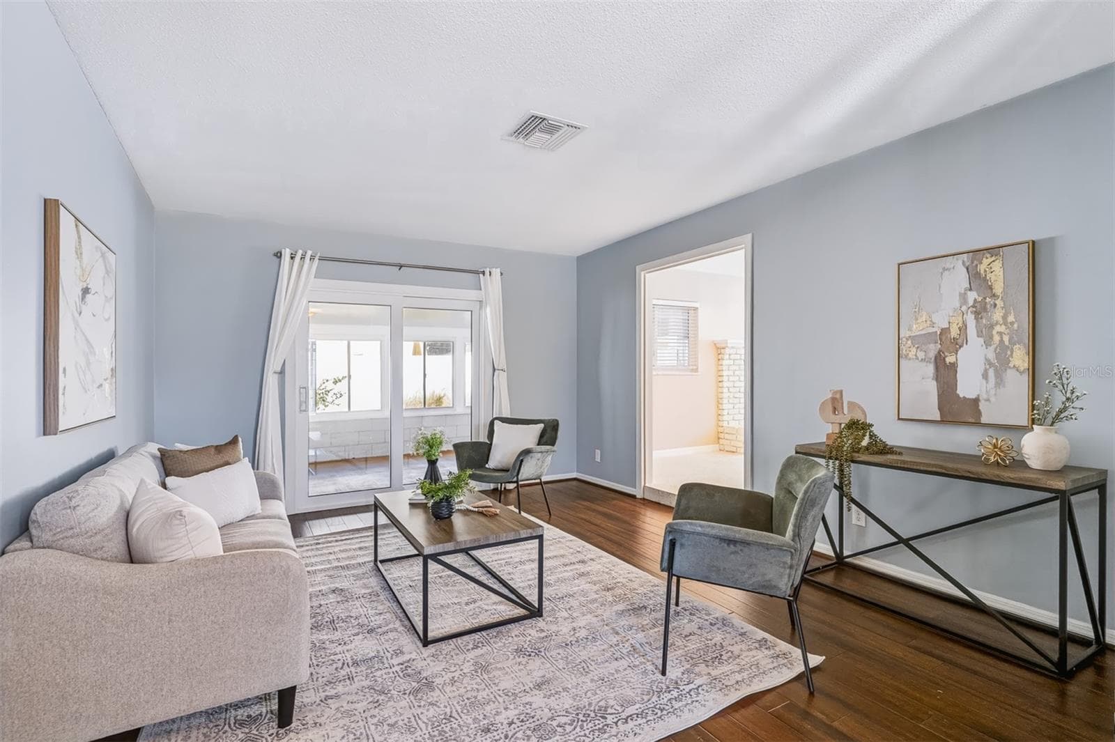 Family Room with Sliders Leading to Enclosed Lanai - 624 DUNRAVEN DR, WINTER PARK