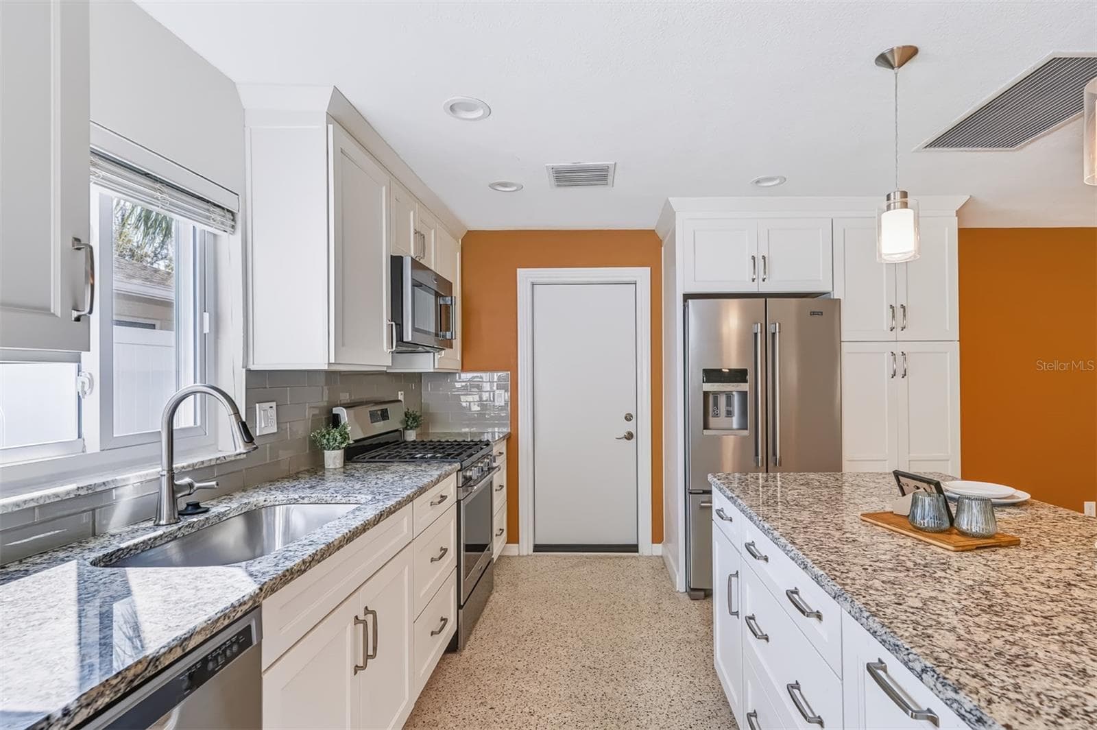 Kitchen with New Gas Range and Island with Storage & Power - 624 DUNRAVEN DR, WINTER PARK