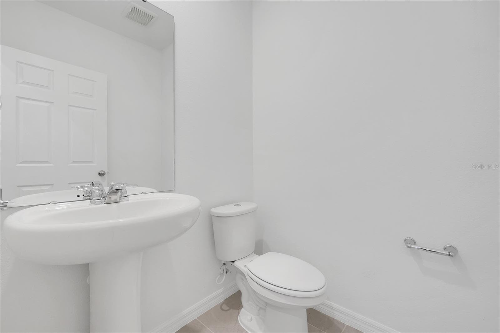 Half Bath located on the first floor - 2401 WHITE TAIL ST, DAVENPORT
