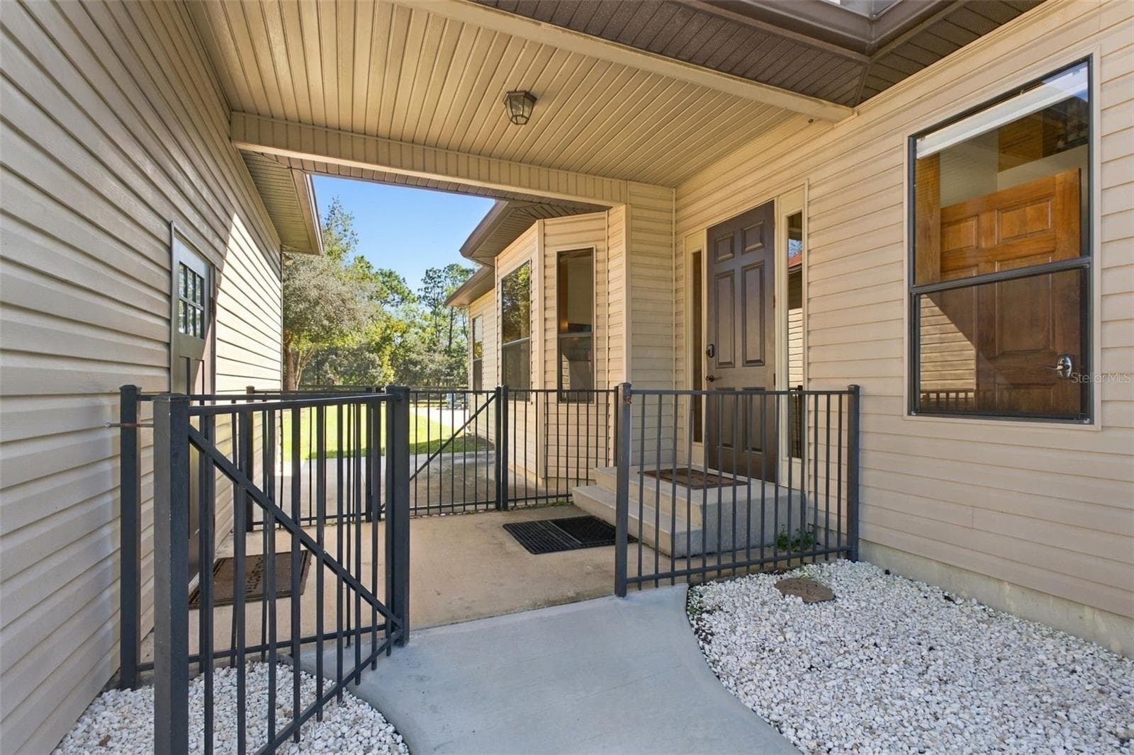 BREEZEWAY TO GARAGE - 10484 GYPSY AVE, WEEKI WACHEE