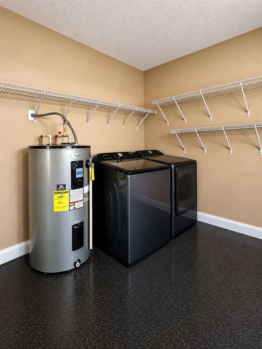 Garage w/laundry area - 408 CARDINAL CT, POINCIANA