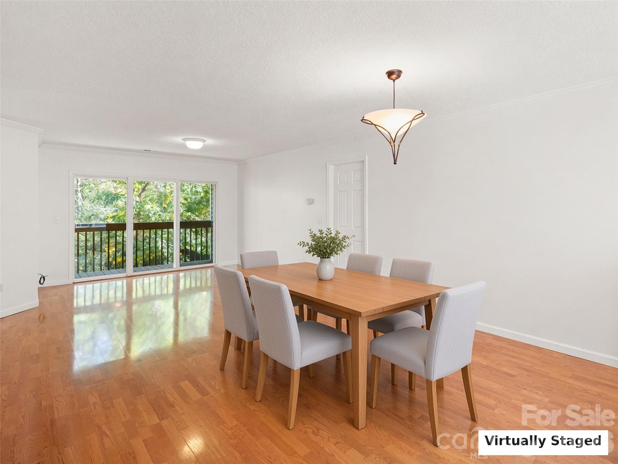 Virtually Staged. Dining area with deck access and natural light. - 206 Waters Edge Drive, Weaverville