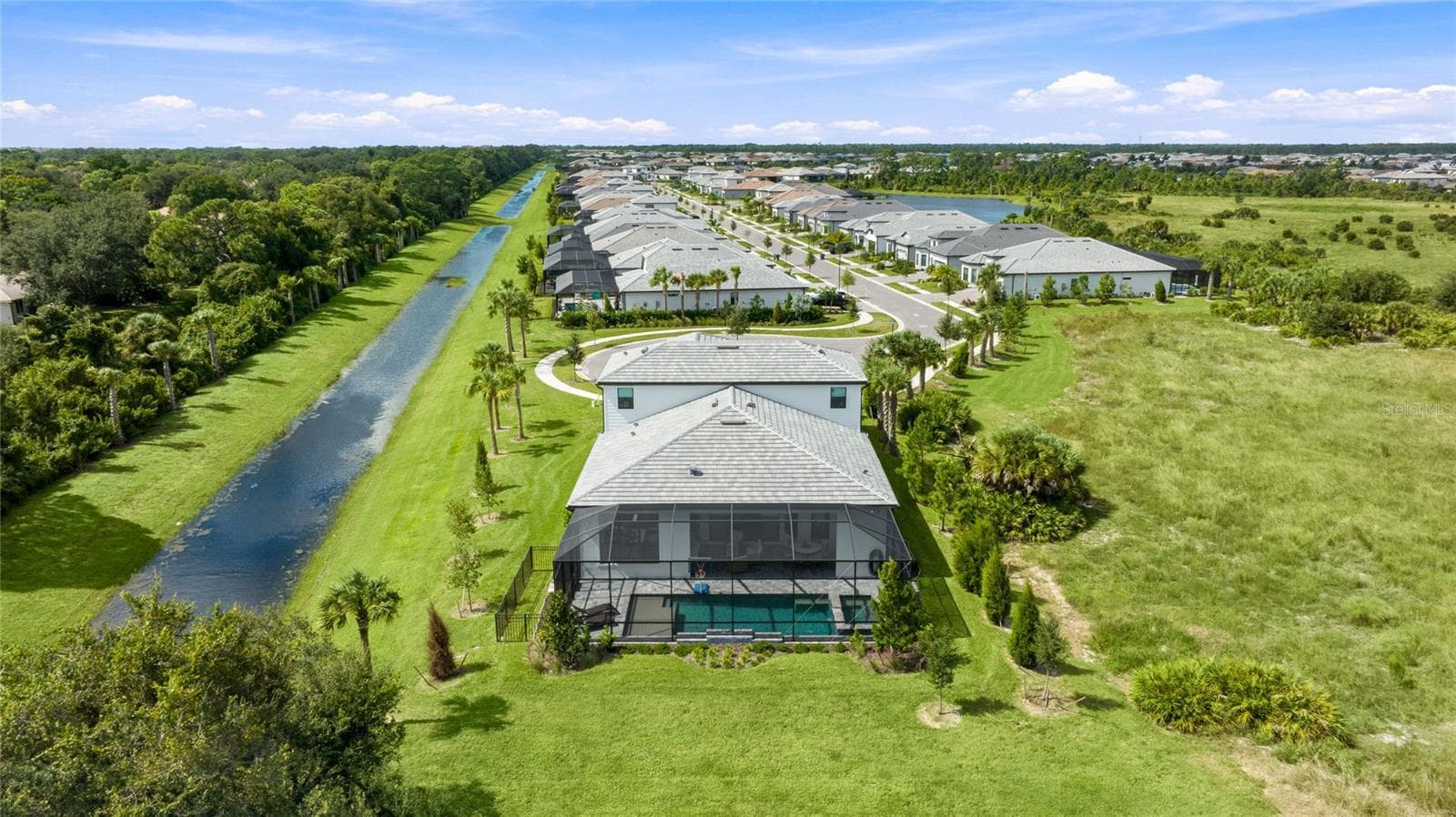 Rear Ariel view of the homehighlighting it sole residence on this cul-de-sac with preserve view and side water view. - 14726 EAGLE BRANCH DR, NOKOMIS
