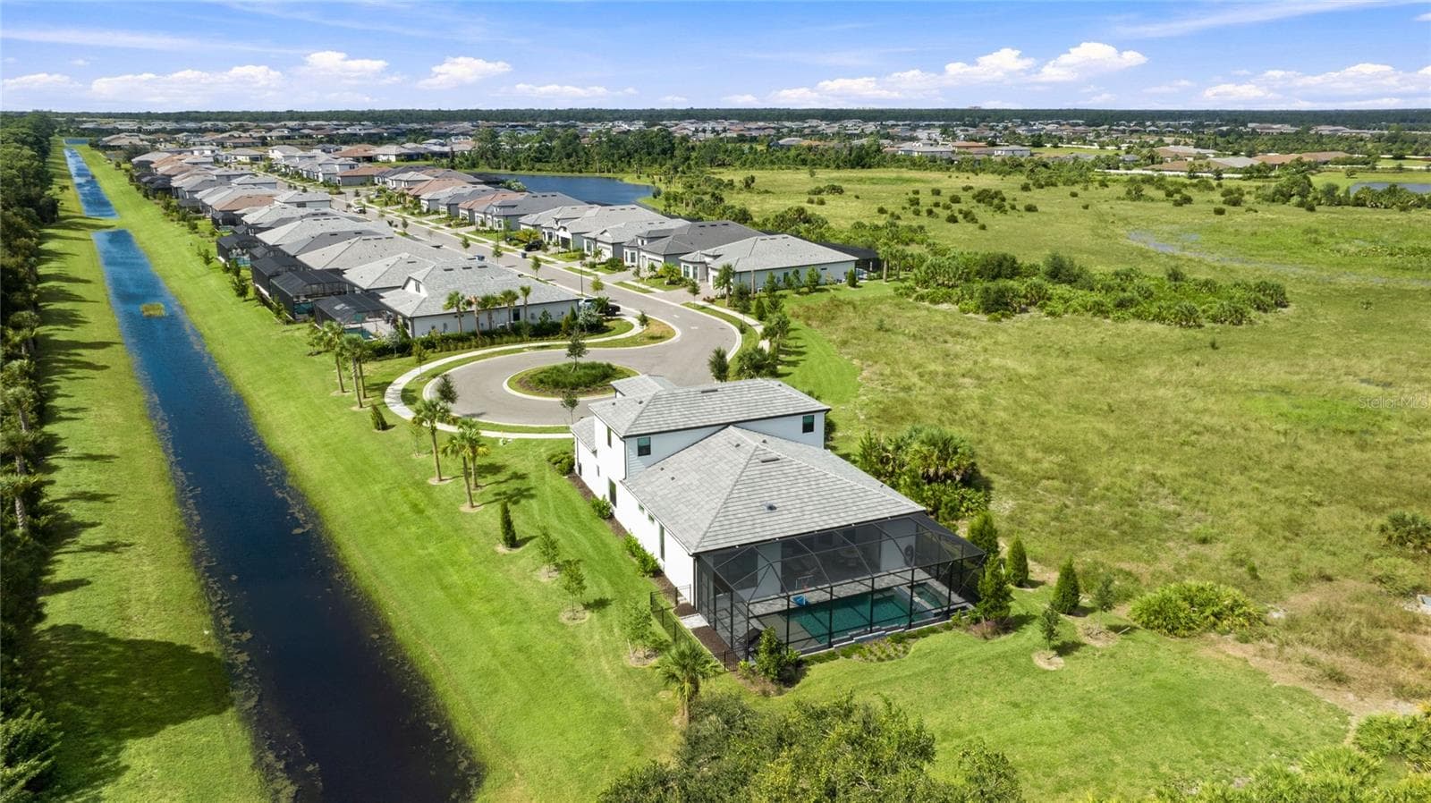 Rear Ariel view of the homehighlighting it sole residence on this cul-de-sac with preserve view and side water view. - 14726 EAGLE BRANCH DR, NOKOMIS