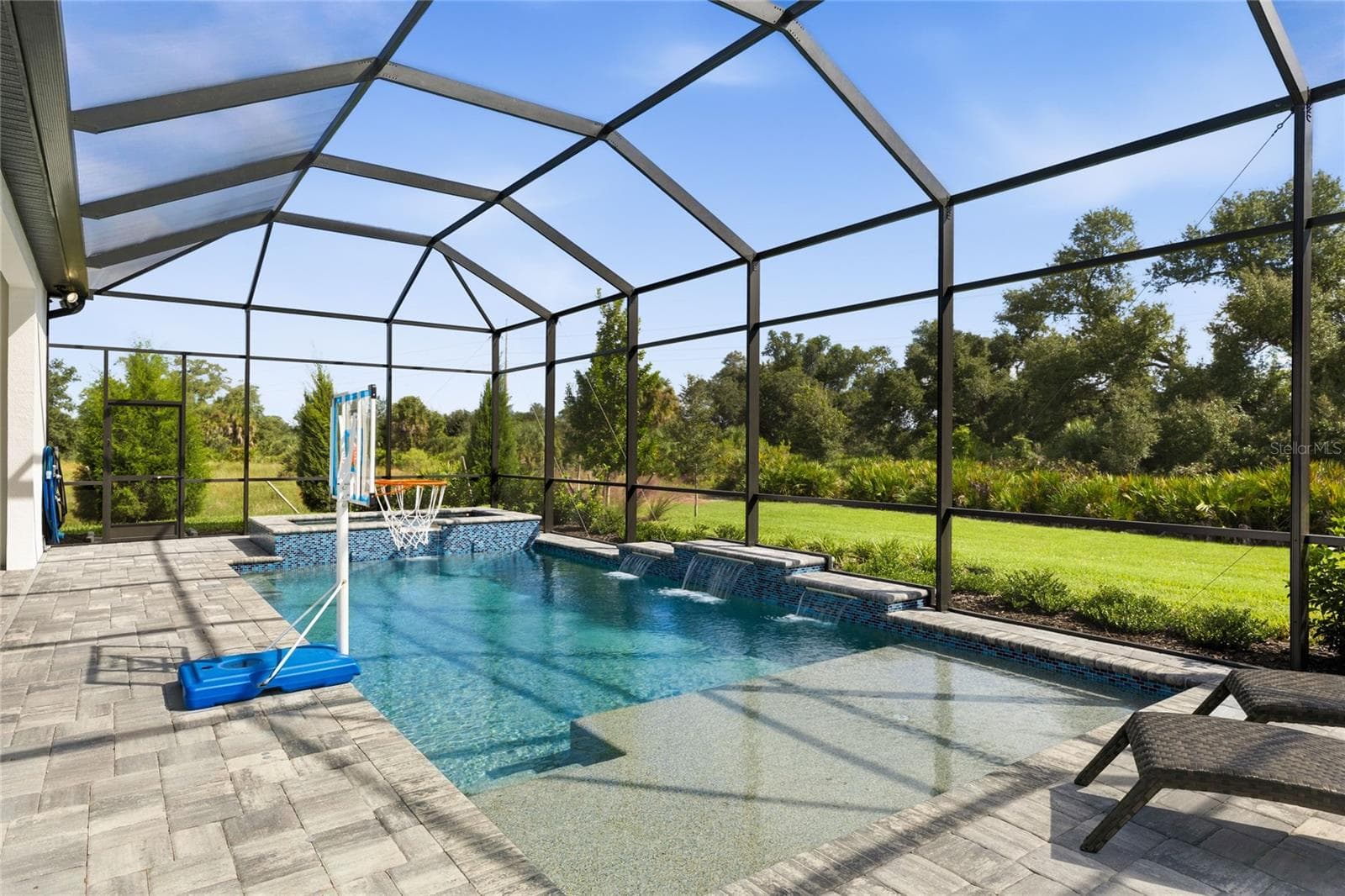 Custom Saltwater Pool with expansive spillover Spa, additional water features and Pool Shelf. - 14726 EAGLE BRANCH DR, NOKOMIS