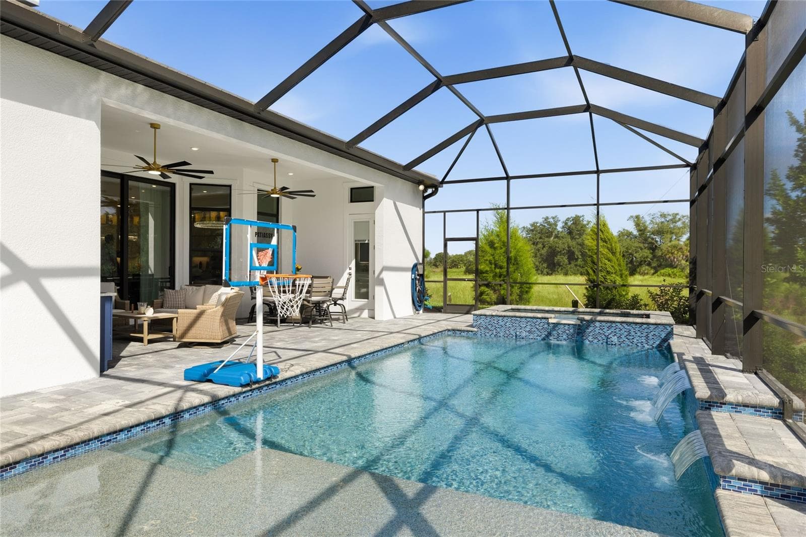 Custom Saltwater Pool with expansive spillover Spa, additional water features and Pool Shelf. - 14726 EAGLE BRANCH DR, NOKOMIS