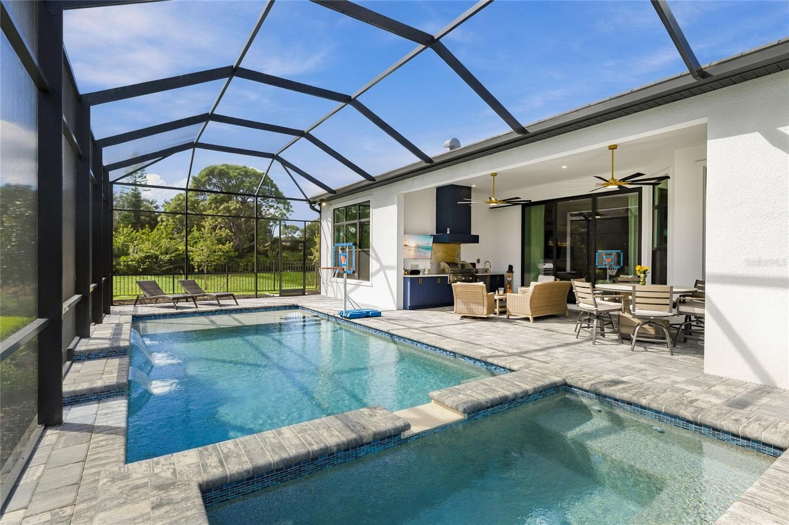 Custom Saltwater Pool with expansive spillover Spa, additional water features and Pool Shelf. - 14726 EAGLE BRANCH DR, NOKOMIS