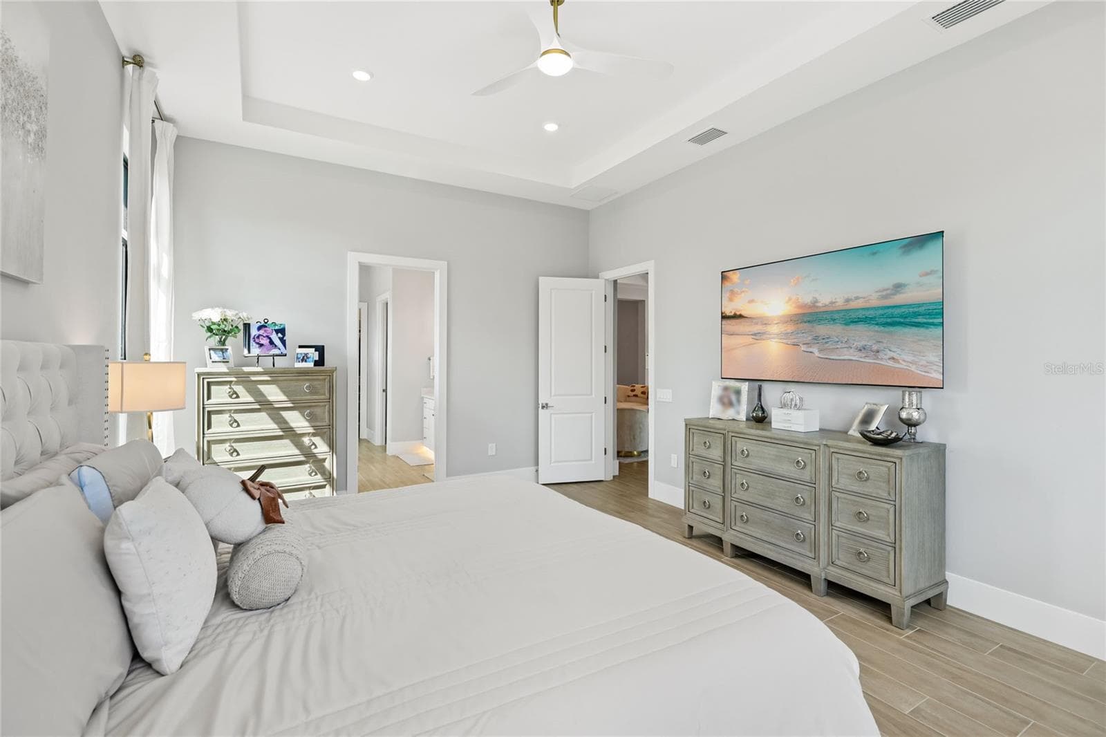 Primary Bedroom Ensuite with expansive windows overlooking the Lanai and custom pool. - 14726 EAGLE BRANCH DR, NOKOMIS