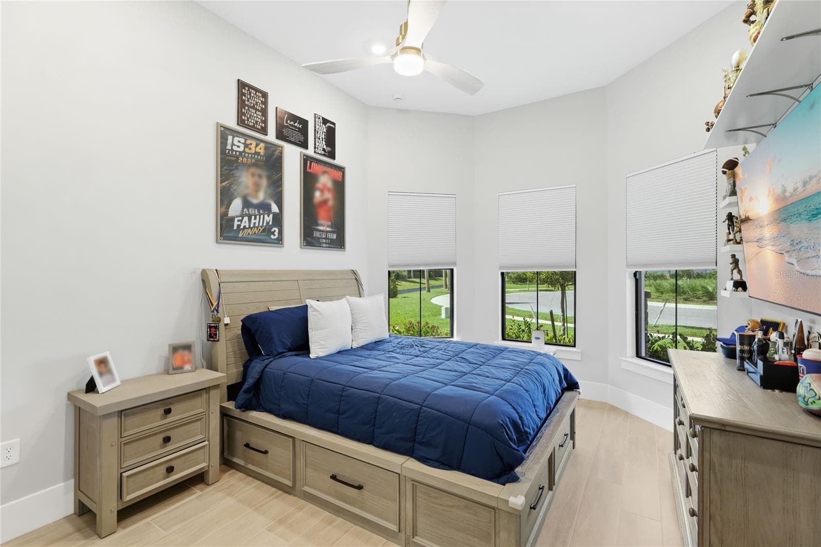 Bedroom 2 with front bay window, ceiling fan, built-in closet with lighting. - 14726 EAGLE BRANCH DR, NOKOMIS