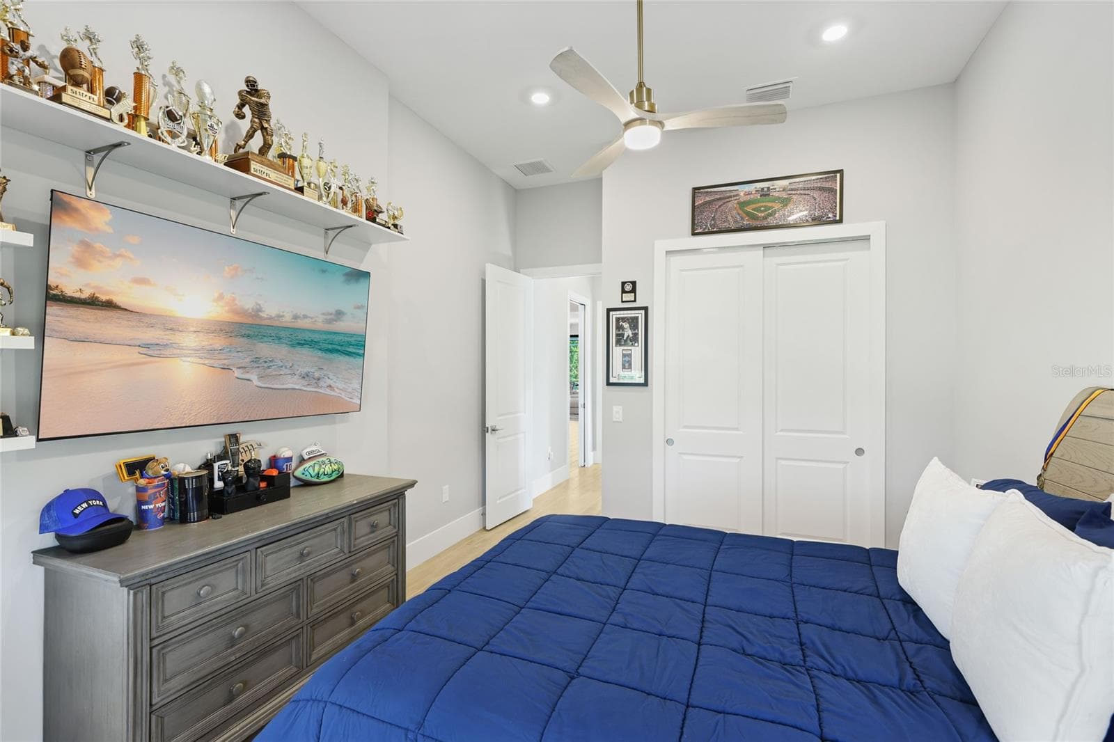 Bedroom 2 with front bay window, ceiling fan, built-in closet with lighting. - 14726 EAGLE BRANCH DR, NOKOMIS