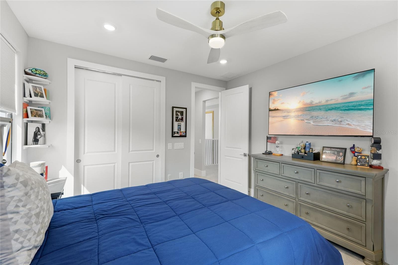 Bedroom 5 with ceiling fan and built in closet. Great water view over-looking the side of the home and creek. - 14726 EAGLE BRANCH DR, NOKOMIS