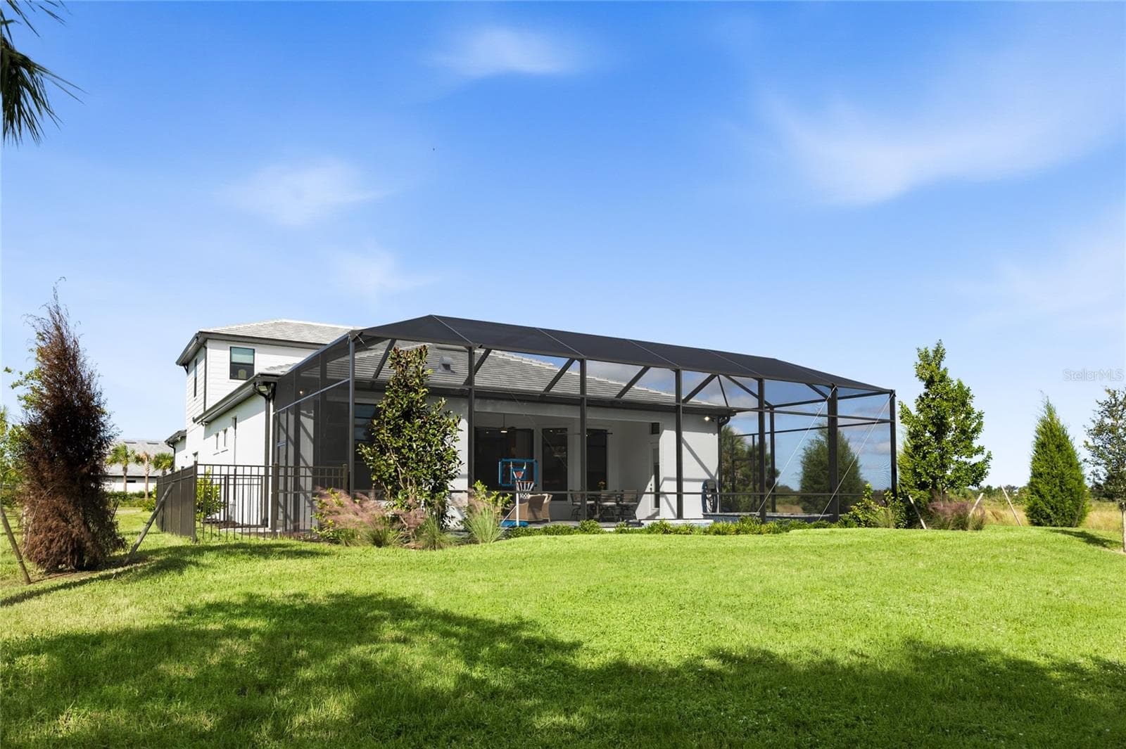 Rear of home is lush landscaping. - 14726 EAGLE BRANCH DR, NOKOMIS