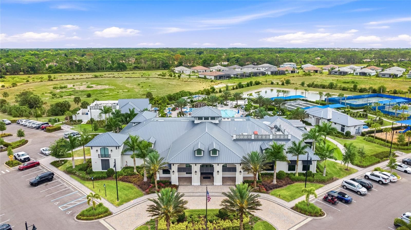 Talon Preserve offers an impressive resort-style amenity package including a heated resort pool with rock waterfall and splash pad, spa, full-service restaurant and bar, approximately 18,000-square-foot clubhouse, state-of-the-art fitness center, arcade, eight pickleball courts, tennis and bocce courts, fire-pit area, and dog park. - 14726 EAGLE BRANCH DR, NOKOMIS
