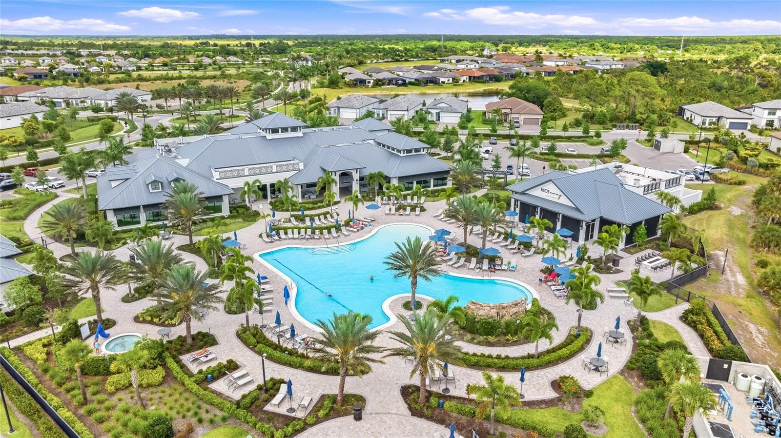 Talon Preserve offers an impressive resort-style amenity package including a heated resort pool with rock waterfall and splash pad, spa, full-service restaurant and bar, approximately 18,000-square-foot clubhouse, state-of-the-art fitness center, arcade, eight pickleball courts, tennis and bocce courts, fire-pit area, and dog park. - 14726 EAGLE BRANCH DR, NOKOMIS