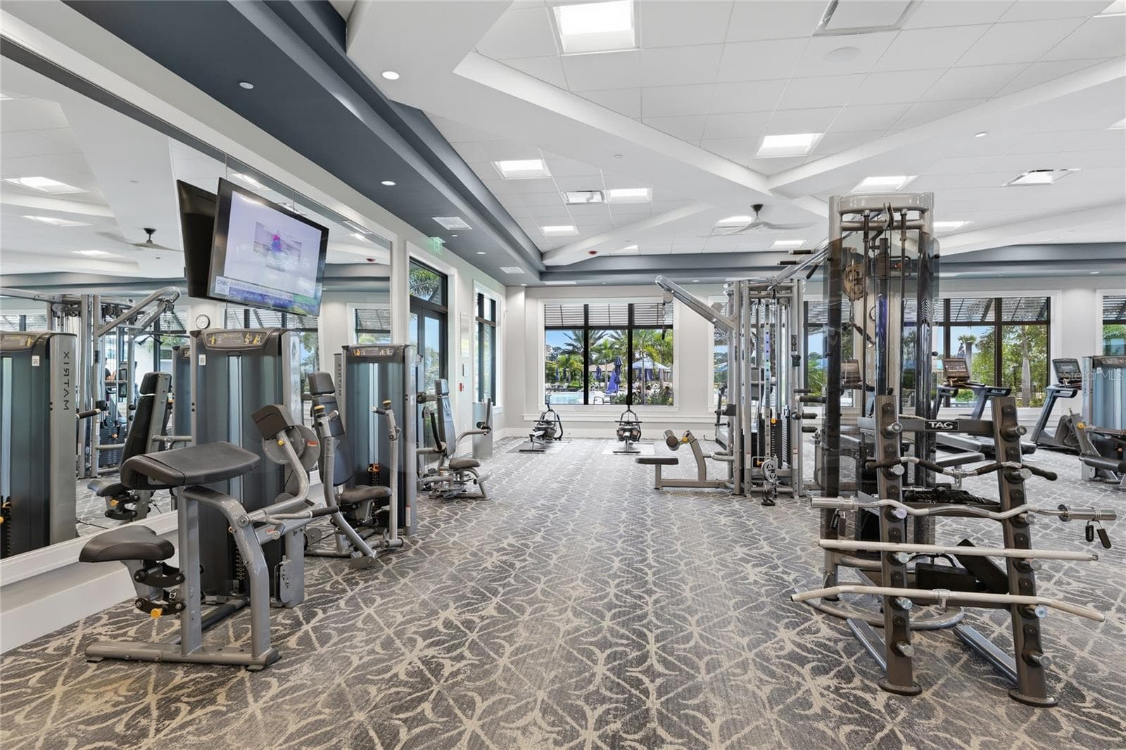 Fitness Center overlooking the resort style pool. - 14726 EAGLE BRANCH DR, NOKOMIS
