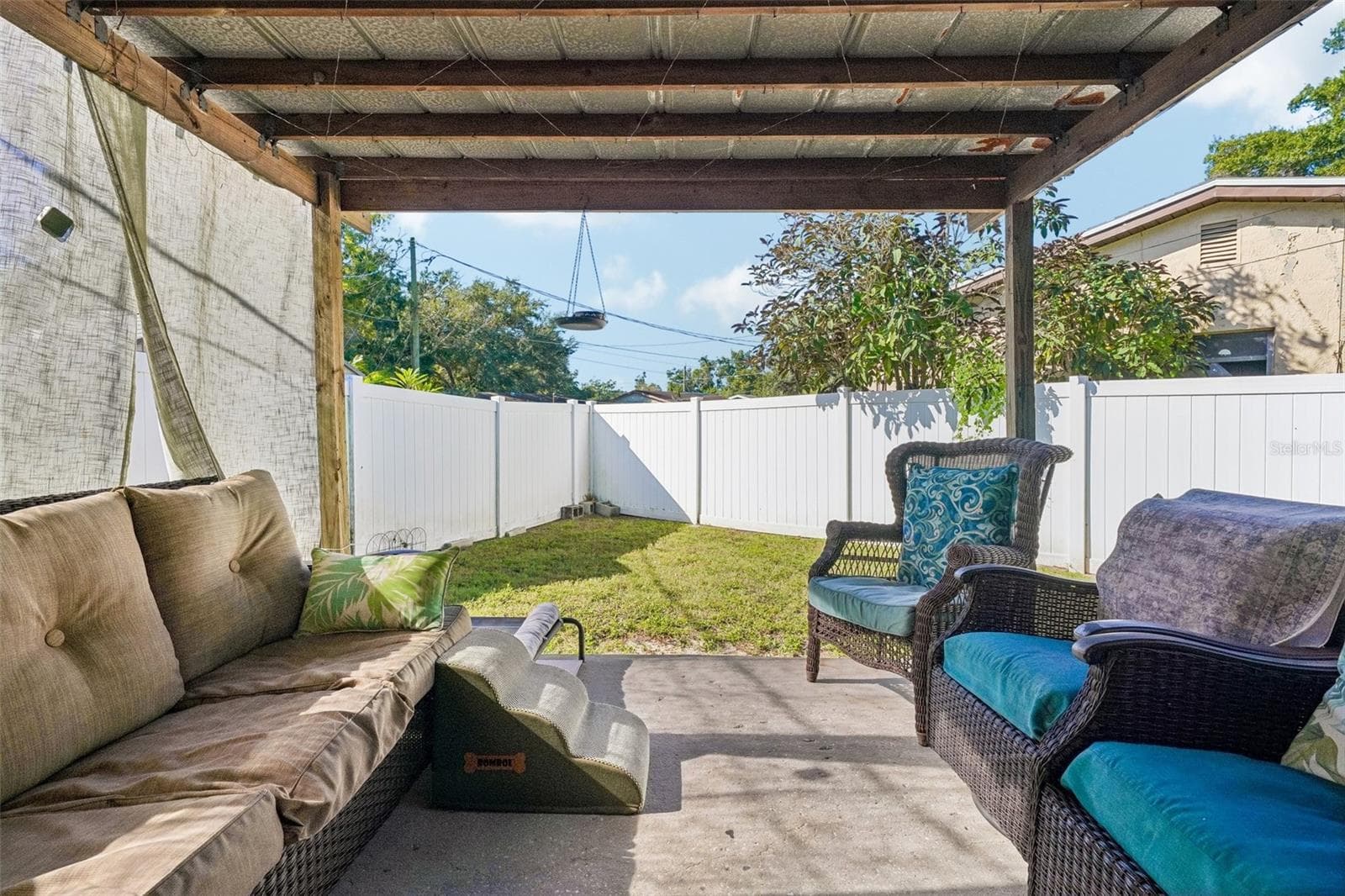 Unit 1 covered outdoor area- white vinyl fence for privacy - 4100 45TH AVE N, ST PETERSBURG
