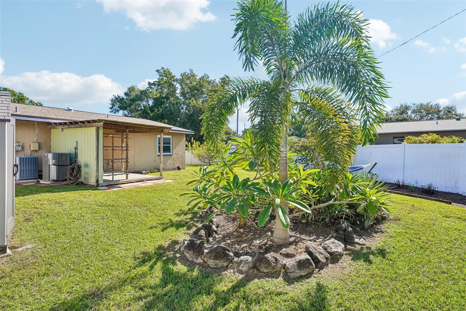 pretty landscaping with privacy fence. - 4100 45TH AVE N, ST PETERSBURG